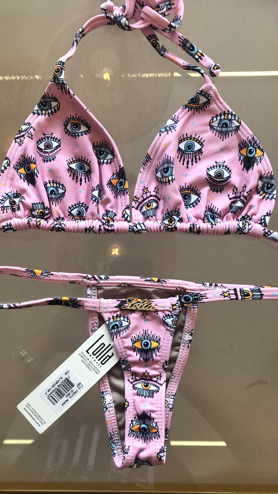 FITA FRENTE MENOR FIO DENTAL OLHO ROSA